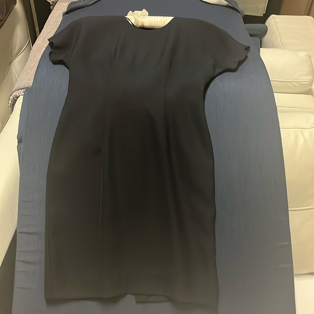 Cocktail   dress round neck with deep v in the back met with a rose appliqué